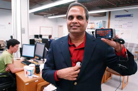 Dr. Ram Dantu showing the mobile phone application that measures blood pressure